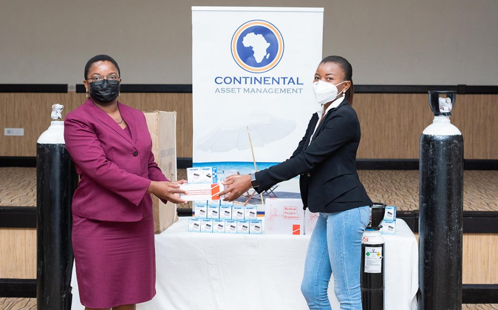 CAM CEO Mrs Gilllian Kachikondo making a symbolic handover to SMD representative Dr. Winnie Mhone