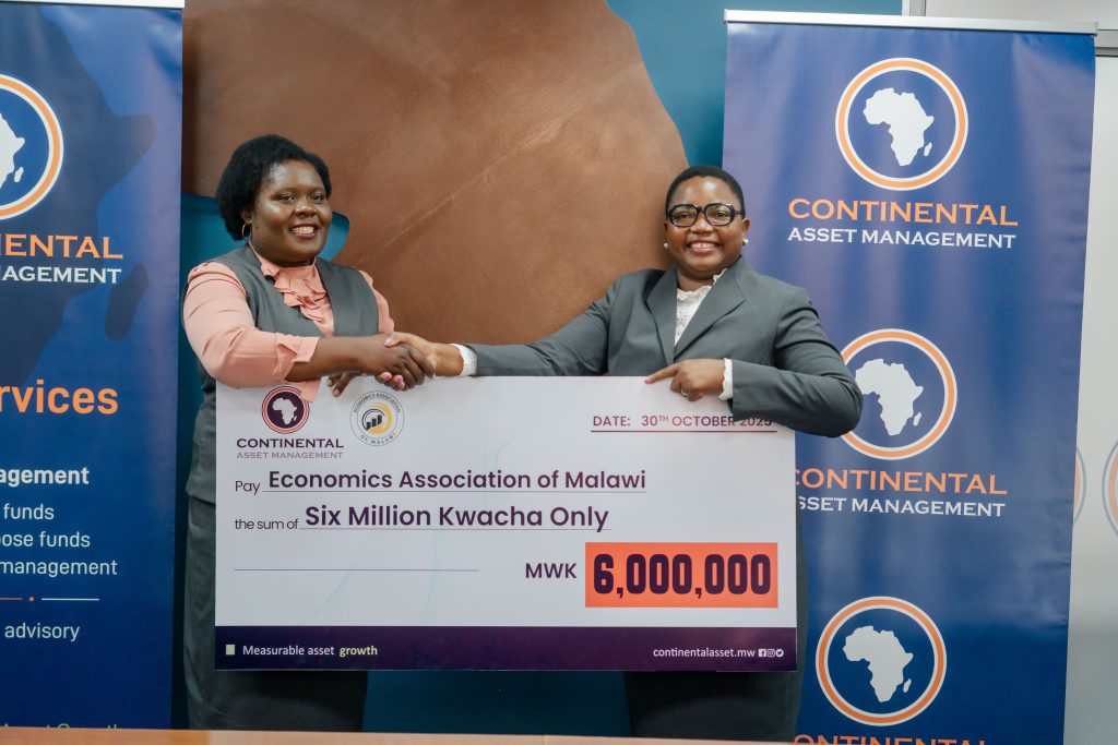 Kachikondo (right) making the symbolic presentation to Kanyumbu (Left)