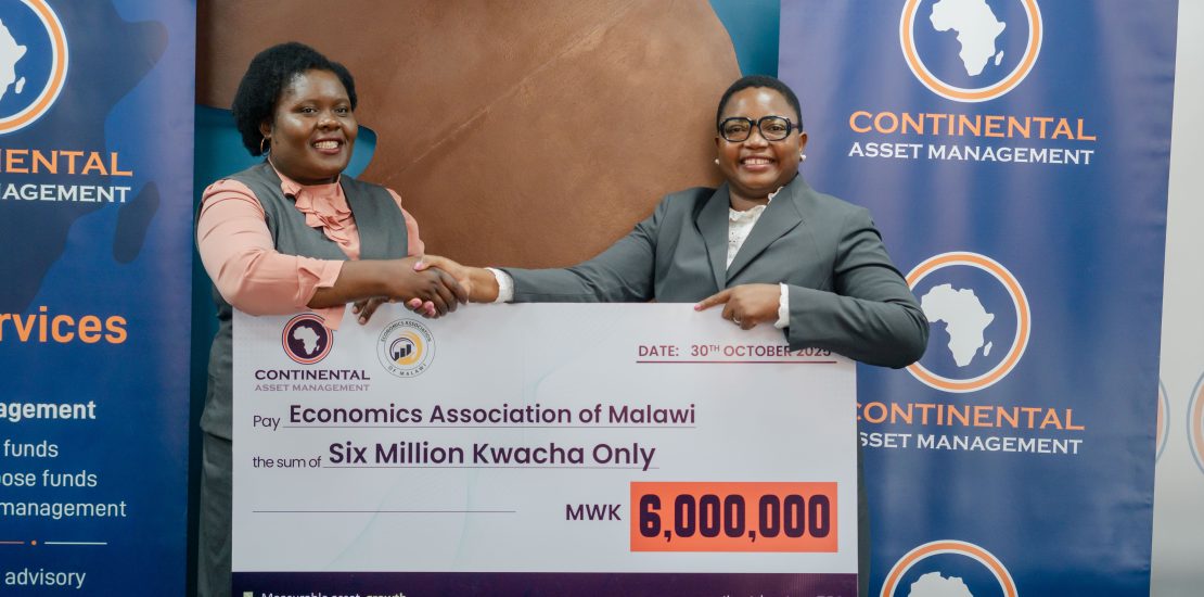 Kachikondo (right) making the symbolic presentation to Kanyumbu (Left)