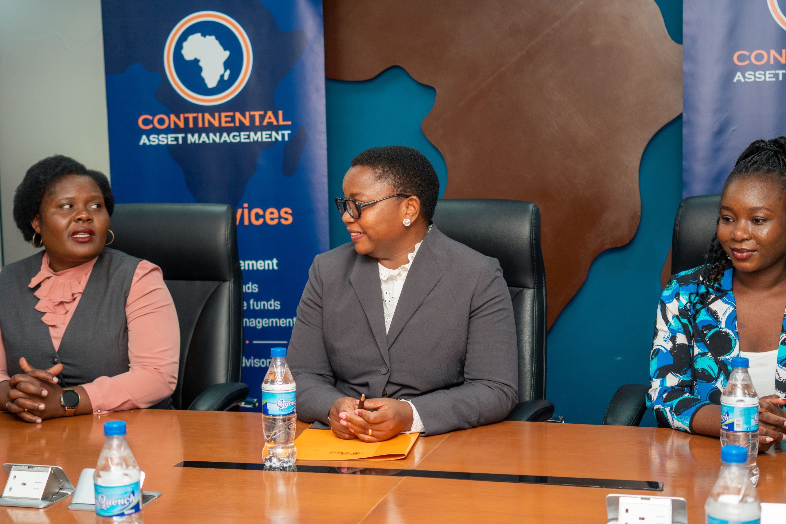 Kachikondo (centre) shares a warm greeting with Kanyumbu (left), while ECAMA Economist for Policy and Research, Tadala Mauluka (right) looks on.